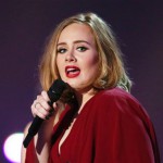 FILE - In this Feb. 24, 2016 file photo shows Adele onstage at the Brit Awards 2016 at the 02 Arena in London. Adele told concertgoers at a show in San Jose, Calif., on Sunday, July 31, that her credit card was declined at a fashion retailer earlier that day. (Photo by Joel Ryan/Invision/AP, File)