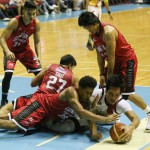 FOUR Ginebra San Miguel players, from left, Aljon Mariano, Jervy Cruz, Joe Devance and Jayjay Helterbrand gang up on San Miguel Beer center June Mar Fajardo in battling for the loose ball in Sunday’s Game 4 in the PBA Governors’ Cup semifinals at the Smart Araneta Coliseum. San Miguel easily won, 101-72, to tie the series and set up a do-or-die Game 5 for a finals berth. (Rio Deluvio)