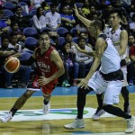Ginebra's LA Tenorio drives against Mahindra's Jeric Teng and teammate Mark Yeeduring the PBA Philippine Cup at the Araneta Coliseum on Friday night. (Jay Ganzon)