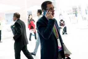A visitor speaks on his phone in a hall on the last day of the Mobile World Congress (MWC) in Barcelona, (Josep Lago / AFP)
