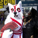 Christiana Broughton, left, and her mom Carolyn, both of Jacksonville, Fla., dressed as Amaterasu from the video game Okami and a 70's-era Black Panther, attend the first day of Comic-Con International at the San Diego Convention Center in San Diego, Calif., on Thursday, July 20, 2017. (Kevin Sullivan/The Orange County Register via AP)