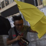 Pedestrians struggle with their umbrellas during strong winds and rain brought on by severe tropical storm Pakhar in Hong Kong (Anthony WALLACE / AFP)