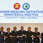 U.S. State Secretary Rex Tillerson, center, links arms with ASEAN foreign ministers before the 10th Lower Mekong Initiative Ministerial Meeting, part of the Association of Southeast Asian Nations Regional Forum in Manila, Philippines, Sunday Aug. 6, 2017. (Mohd Rasfan/Pool Photo via AP)