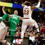 Boston Celtics' Gordon Hayward (20) falls as Cleveland Cavaliers' LeBron James (23) reaches for a loose ball in the first half of an NBA basketball game, Tuesday, Oct. 17, 2017, in Cleveland. (AP Photo/Tony Dejak)