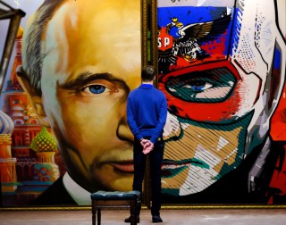 A MAN looks at a painting depicting Russian President Vladimir Putin at the ‘Superputin’ exhibition at the UMAM museum in Moscow. (AFP)