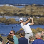 Dustin Johnson follows his shot from the 13th tee of the Monterey Peninsula Country Club Shore Course during the second round of the AT&T Pebble Beach National Pro-Am golf tournament Friday, Feb. 9, 2018, in Pebble Beach, Calif. (AP Photo/Eric Risberg)