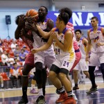 Clement Leutcheu of Go for Gold CSB defended by Rodrigue Ebondo and Jay Manlangit of the CEU Scorpions (PBA Images)