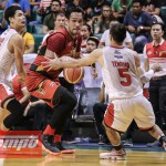 SAN MIGUEL center June Mar Fajardo (center) fights off the double-team put up by Japeth Aguilar (left) and LA Tenorio in PBA semifinal action Saturday at the Cuneta Astrodome in Pasay City. The Beermen won, 100-94. (MB photo | Rio Leonelle Deluvio)
