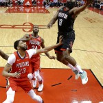 Houston Rockets guard James Harden, right, drives to the basket past New Orleans Pelicans forward Anthony Davis (23) during NBA action in Houston. The Rockets won, 114-91. (AP)