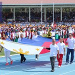 SPORTS heroes carry the huge Philippine flag during the opening ceremonies of the Palarong Pambansa yesterday at the President Elpidio Quirino stadium in Vigan, Ilocos Sur. From left: bowler Paeng Nepomuceno, trackster Elma Muros, billiards legend Efren ‘Bata’ Reyes, archer Gab Moreno, boxer Mansueto ‘Onyok’ Velasco, weightlifter Hidilyn Diaz and chess icon Eugene Torre. (MB photo | Rio Leonelle Deluvio)