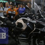PRESIDENT Duterte admires a BMW motorcycle on display at the 24th annual convention of the National Federation of Motorcycle Clubs of the Philippines in Legazpi City, Albay. (MB photo | Camille Ante)