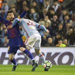Barcelona's Lionel Messi challenges for the ball with RC Celta's Roncaglia. (AP Photo/Lalo R. Villar)