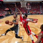 Golden State Warriors guard Stephen Curry (30) goes to the basket against New Orleans Pelicans forward Anthony Davis. (AP Photo/Gerald Herbert)