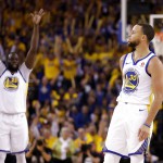 Golden State Warriors' Draymond Green, left, raises his arms in celebration after a 3-point basket by teammate Stephen Curry. (AP Photo/Marcio Jose Sanchez)