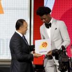 NBA Deputy Commissioner Mark Tatum, left, congratulates Phoenix Suns forward Josh Jackson after Tatum announced that the Suns had won the first pick for the NBA basketball draft, during the draft lottery. (AP Photo/Charles Rex Arbogast)