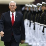 Vice President Mike Pence is saluted as he arrives to speak at the commencement for the United States Coast Guard Academy. (AP Photo/Jessica Hill)