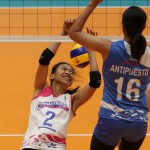 Angel Antipuesto of Pocari foils one of Creamline’s Alyssa Valdez’s vaunted attacks in sudden death of their semis duel.