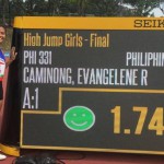 Pinay high jumper Evangelene Caminong of San Vicente, Palawan poses beside the LED where her new personal record was shown minutes after winning the first gold medal for the Philippines at the 2018 ASEAN Schools Games. (PSC PHOTO)