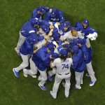 The Los Angeles Dodgers celebrate after Game 7 of the National League Championship Series baseball game against the Milwaukee Brewers in Milwaukee. The Dodgers won 5-1 to advance to the World Series. (AP)