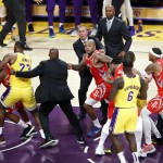 Houston Rockets’ Chris Paul, far left, is held back by Los Angeles Lakers’ LeBron James, second from left, after Paul fought with Lakers’ Rajon Rondo, far right, during the second half of an NBA basketball game in Los Angeles. The Rockets won, 124-115. (AP)