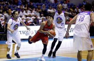 Nico Elorde of NorthPort maneuvers past Terrence Romeo and Marqus Blakely of TnT KaTropa (PBA Images)