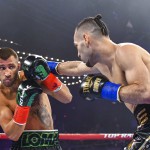 Vasiliy Lomachenko moves away from punch from Jose Pedraza in the WBO lightweight title boxing match at Madison Square Garden, in New York. (AP Photo/Howard Simmons)