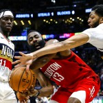 New Orleans Pelicans forward Anthony Davis (23) and guard Jrue Holiday (11) try to steal the ball from Houston Rockets guard James Harden (13) during NBA action in New Orleans. Houston won, 108-104. (AP)