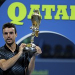 Spain's Roberto Bautista Agut poses with the trophy after winning the ATP Qatar Open tennis final match against Czech Republic's Tomas Berdych (unseen) in Doha on January 5, 2019. (Photo by KARIM JAAFAR / AFP)