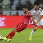 Bahrain’s midfielder Ali Madan (left) and United Arab Emirates’ midfielder Amer Abdulrahman fight for the ball during the AFC Asian Cup group A soccer match between the United Arab Emirates and Bahrain at Zayed Sport City in Abu Dhabi, United Arab Emirates. The match ended in a 1-1 tie. (AP)
