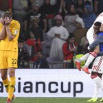 Australia's midfielder Jackson Irvine , left, holds his head after losing 1-0 to United Arab Emirates during the AFC Asian Cup quarterfinal soccer match at Hazza Bin Zayed Stadium in Al Ain, United Arab Emirates, Friday, Jan. 25, 2019. (AP Photo/Hassan Ammar)