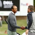 Tiger Woods of the United States embraces Rory McIlroy of Northern Ireland after defeating him 2&1 during the fourth round of the World Golf Championships-Dell Technologies Match Play at Austin Country Club in Austin, Texas. (AFP)