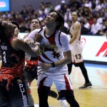 June Mar Fajardo of San Miguel Beer jockeys for position with Jason Perkins of Phoenix Pulse (PBA images)
