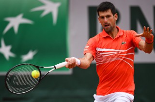 Serbia's Novak Djokovic returns the ball to Germany's Jan-Lennard Struff (Photo by Christophe ARCHAMBAULT / AFP)