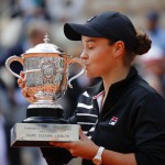 Australia's Ashleigh Barty kisses the trophy as she celebrates winning her women's final match of the French Open tennis tournament against Marketa Vondrousova of the Czech Republic in two sets 6-1, 6-3, at the Roland Garros stadium in Paris, Saturday, June 8, 2019. (AP Photo/Christophe Ena)