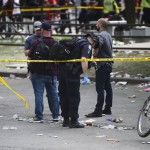 Toronto Police search for evidence after shots were fired during the Toronto Raptors NBA basketball championship parade in Toronto (Andrew Lahodynskyj/The Canadian Press via AP)
