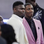 Duke's Zion Williamson, left, and RJ Barrett speak before the NBA basketball draft Thursday, June 20, 2019, in New York. (AP Photo/Julio Cortez)