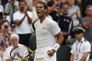Spain's Rafael Nadal celebrates beating Australia's Nick Kyrgios (Photo by Adrian DENNIS / AFP)