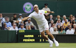 Switzerland's Roger Federer returns to South Africa's Lloyd Harris (AP Photo/Ben Curtis)