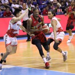 Chris McCullough of San Miguel Beer drives past JC Intal and Alex Mallari of Phoenix Pulse (PBA Images)