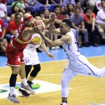 Mark Caguioa of Ginebra tries to prevent Jayson Castro of TnT from controlling the loose ball. (PBA Images)