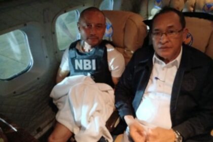 Former Rep. Arnie Teves (left) accompanied by NBI Director Jaime Santiago on a return flight to the Philippines. (NBI)